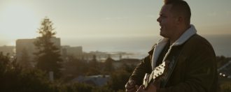 Jake Davey performing at sun rise music video