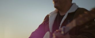 Jake Davey performing at sun rise music video