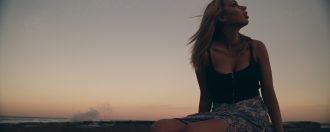 Girl at the beach on sunset