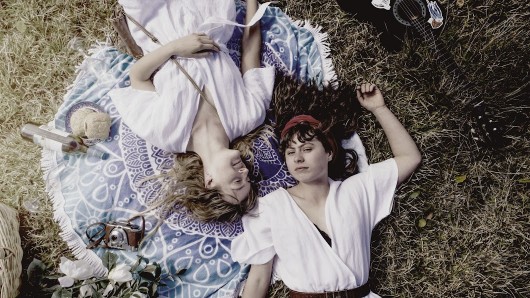 Girls laying down looking up at sky